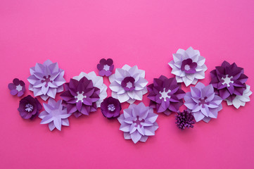 Flowers made of paper. Pink background.