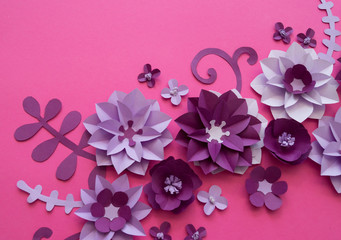 Flowers made of paper. Pink background.