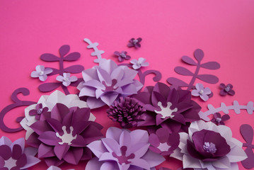 Flowers made of paper. Pink background.
