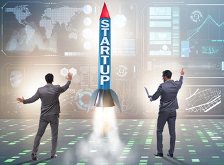 Start-up concept with rocket and businessman