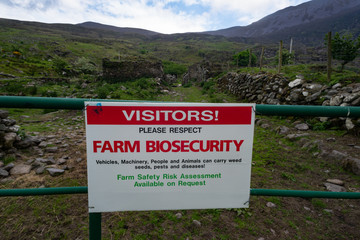 Farm biosecurity warning sign at the gate of a rural farm in county Kerry, Ireland