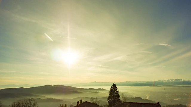 Mountains at Sunset with clouds and fog