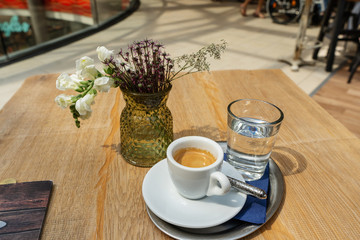 cup of espresso on the table in the cafeteria