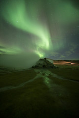 Aurora Borealis (Northern Lights) above geothermal volcanic vents in Hveravellir