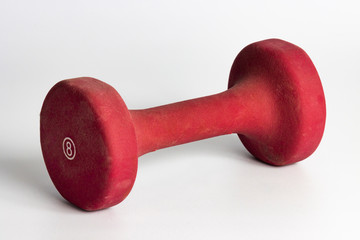 red eight pound bar bell