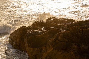 Wave hitting the rocks