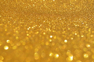 The bokeh of the glittering sheet surface has reflected light.