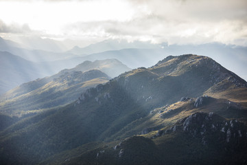 Heavenly light over dramatic mountains in Tasmania, Australia © jamenpercy
