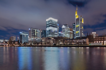 Fototapeta na wymiar The Skyline of Frankfurt by night, seen from the river Main.