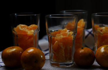 Fototapeta na wymiar Preparing the tangerine in drinking glass to make a orange smoothy