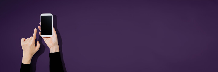 Person using a white smartphone with copyspace