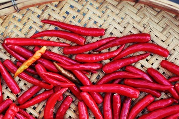 red chili peppers on a wooden background