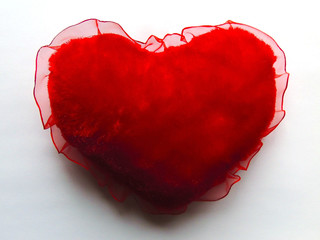 Red heart on a color background. Macro. Colorful. Bright.