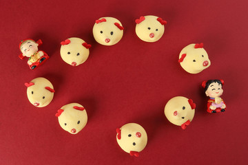Obraz premium Chinese New Year rat mouse shaped cookie boy girl doll on red background