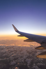 Obraz premium The airplane flew over the clouds. 