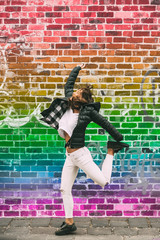 LGTB woman jumps and celebrates gay pride day. 28 june.