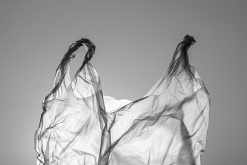 Garbage from plastic bags which is a problem and pollution to the environment and causing global warming close-up black and white tone (monochrome).