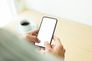 Mockup image blank white screen cell phone.woman hand holding texting using mobile.background empty space for advertise text.people contact marketing business,technology 