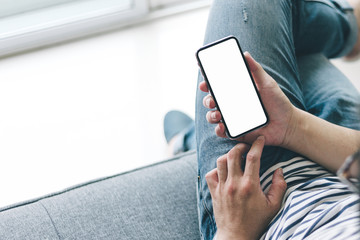 Mockup image blank white screen cell phone.woman hand holding texting using mobile.background empty space for advertise text.people contact marketing business,technology 