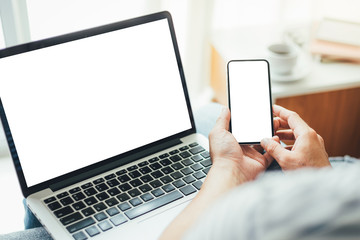 mockup image blank screen computer,cell phone with white background for advertising text,hand woman using laptop texting mobile contact business search information on desk in office.marketing,design