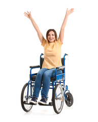 Happy young woman in wheelchair on white background