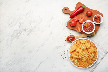 Fototapeta na wymiar Composition with tasty potato chips on table