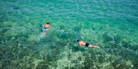 top view of two men snorkeling summer beach holiday