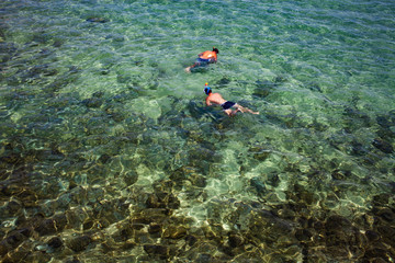 top view of two men snorkeling summer beach holiday