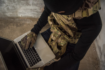 Terrorist man cyber hacker hacking internet to access steal information