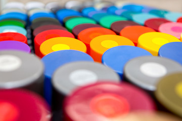 multicolored spray paint cans