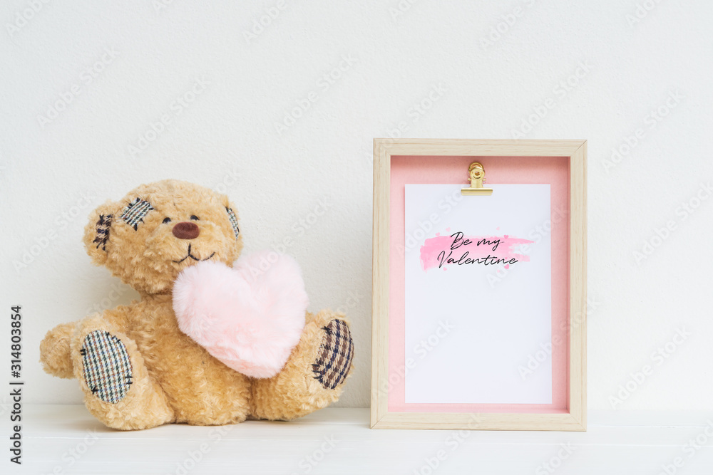 Poster mockup picture frame and cute bear with pink heart. valentines day background concept with copy spac