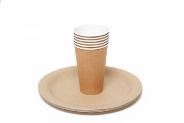 Eco kraft paper tableware. Paper cups and paper plates isolated on white background. Recycling concept. Zero waste.
