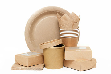 Eco kraft paper tableware. Paper cups, dishes, fast food containers, paper napkins isolated on white background. Recycling concept. Zero waste.