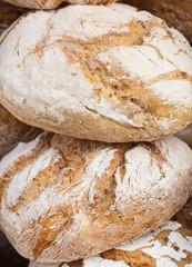 Fresh loaves of rye or wheat bread