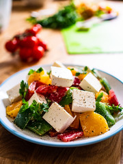  Fresh greek salad on wooden background