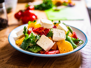  Fresh greek salad on wooden background