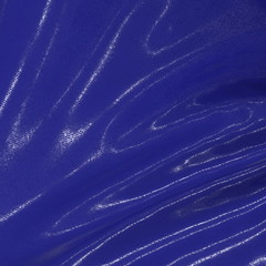 Abstract and shiny luxury silk cloth in shape of liquid wave with folds. Satin or velvet material background in popular Phantom Blue color. 3d illustration