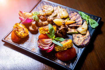 Tasty grilled vegetables on big plate. Healthy food. Restaurant.