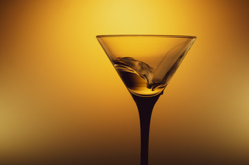 Martini glass with water splash. transparent cocktail