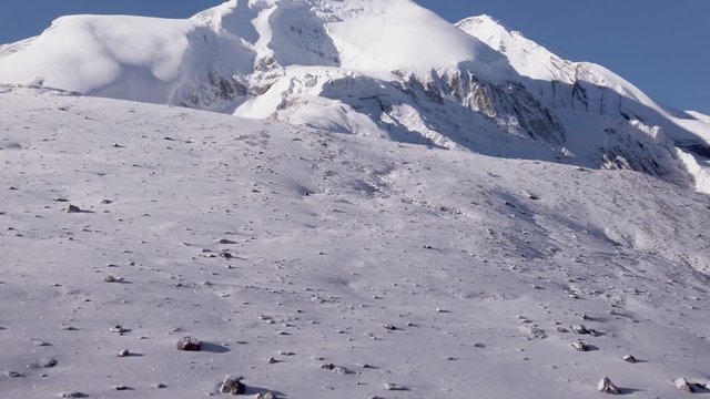 panoramic view of thorung la pass covered by snow during a sunny day himalayan mountains nepal, famous pass at five thousand meters