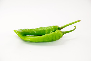 green chilli on white background