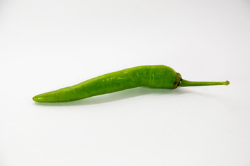 green chilli on white background