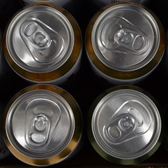 Four beer cans. View from above