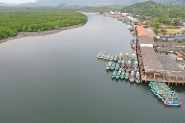 Fishing boats in port in Thailand. Overfishing is a big environmental problem. This shows how big...
