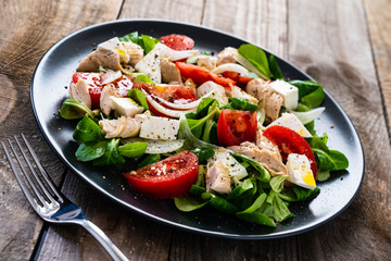 Tasty salad - vegetables , feta cheese and barbecue chicken fillet