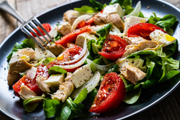 Tasty salad - vegetables , feta cheese and barbecue chicken fillet