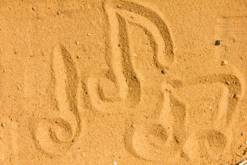 Music notes images Draw on the sand and nature
