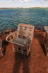 Siwa Oasis, Egypt Sun chairs along the side of Lake Aftnas.