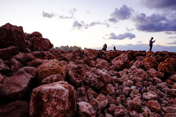 Marsa Matruh, Egypt A family fishing on a rock outcrop