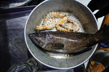Marsa Matrouh, Egypt Fresh fish and shrimp selected in a restaurant for cooking.